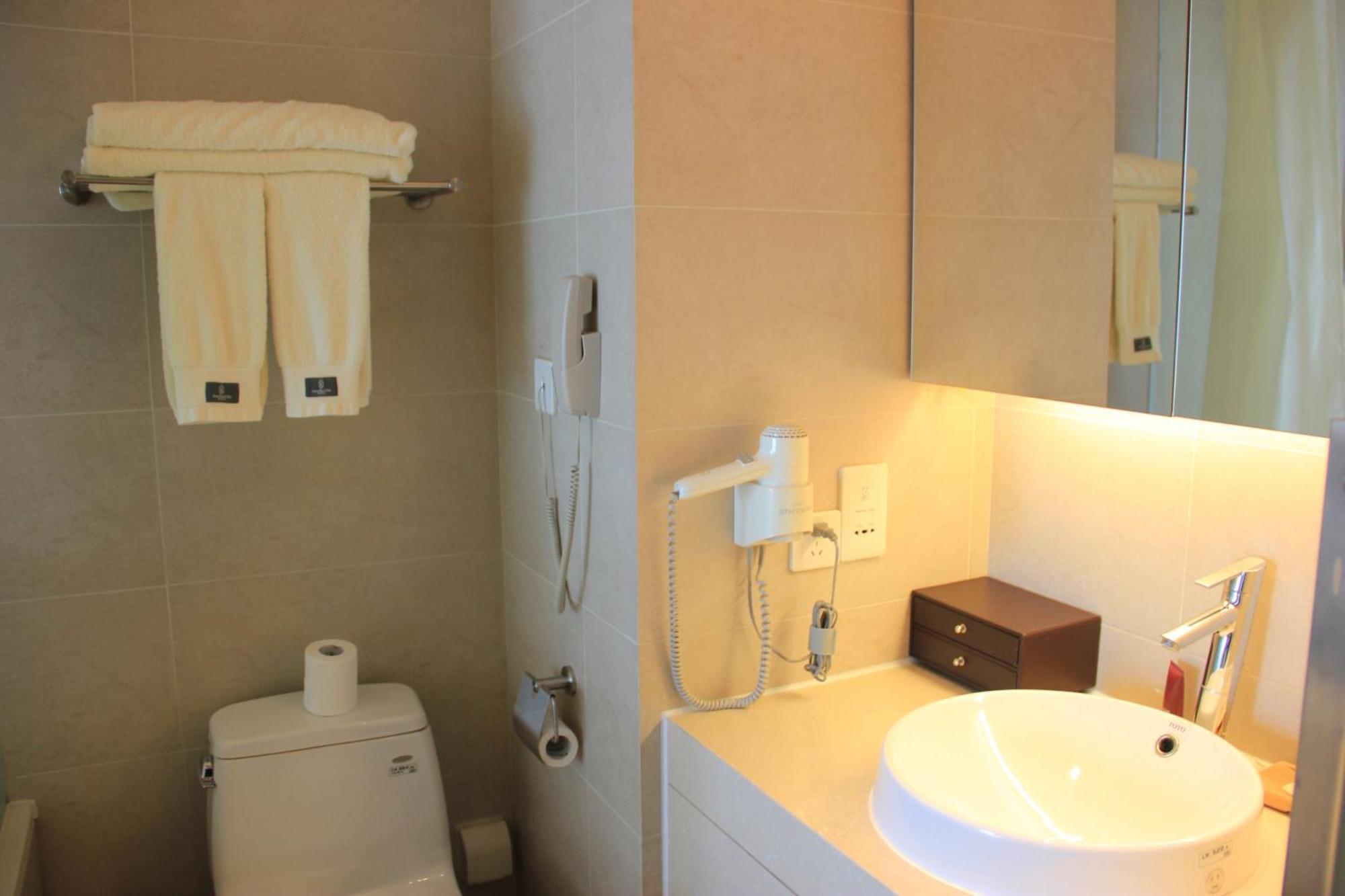 Green Park Hotel Tianjin Binhai  Rum bild
